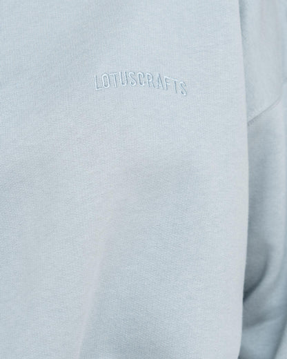 Stone Blue - Model in cropped Yoga Sweater Detail Logo Lotuscrafts