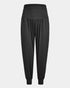 greenyogashop schwarze lange Yogahose Flow aus Bambusviskose mit breitem Bund und Bündchen am Bein